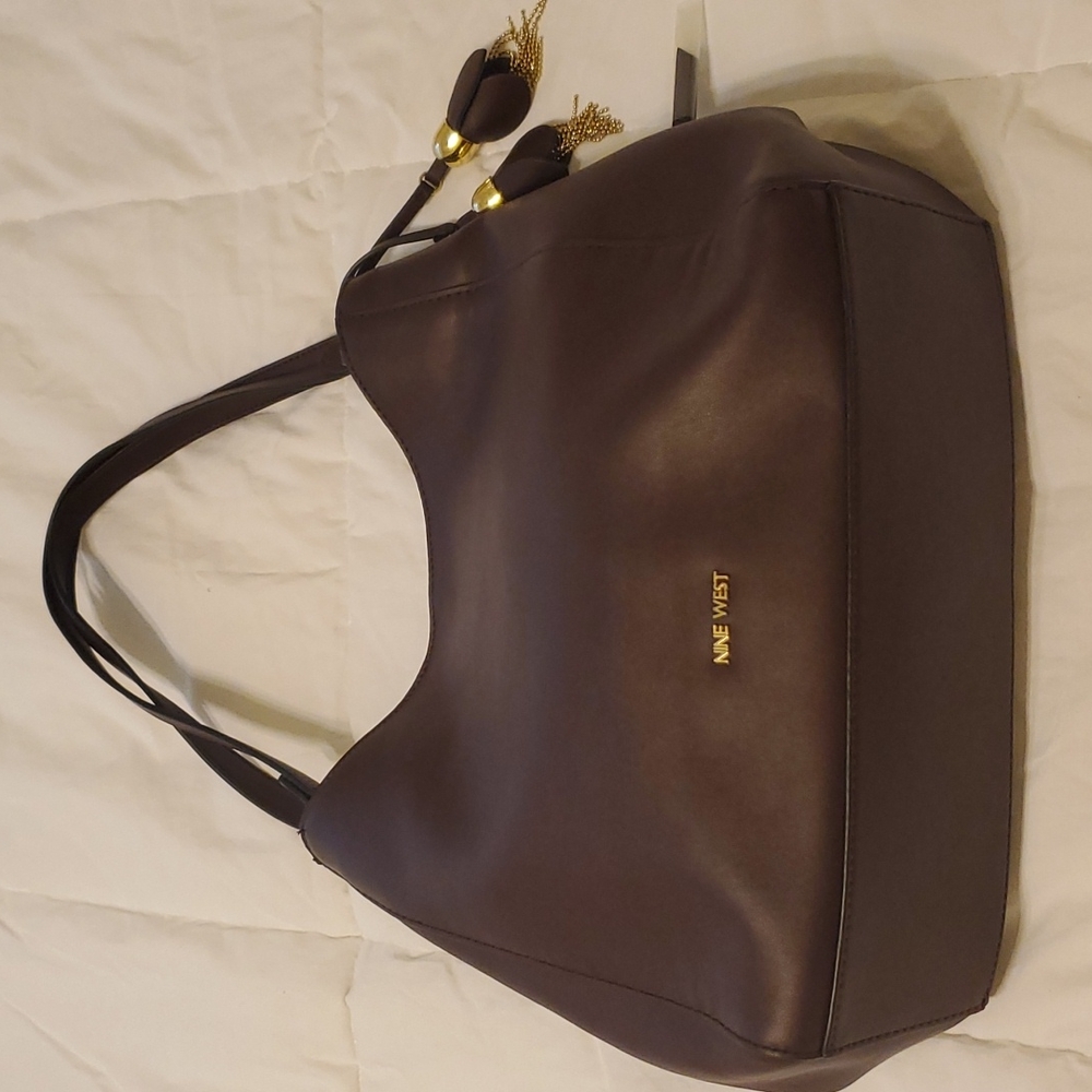 Nine west handbag. Plum color. NWT. Medium size.